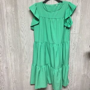 Green tiered dress with flutter sleeves
